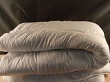 three pillows stacked on top of each other on a table