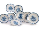 six blue and white plates with blue flowers on them on a white surface