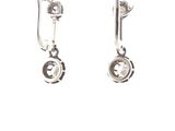 silver plated earrings with crystal stones on them on a white background