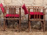 a lot of chairs that are sitting in the grass