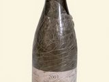 a bottle of wine that is sitting on a table