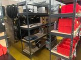a room with a lot of shelves and bins on it