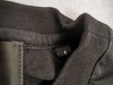 a close up of a person ' s shirt with a tag on it