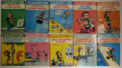 six bandes dessinées pour enfants sont alignées sur un mur