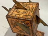 a small wooden box with a clock on top of it