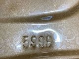 a close up of a car ' s number on the side of the car