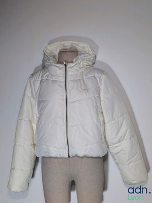 an image of a white jacket on a mannequin mannequin