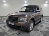 une photo d'une Land Rover marron garée dans un garage
