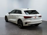 the rear end of a white audi car in a white room