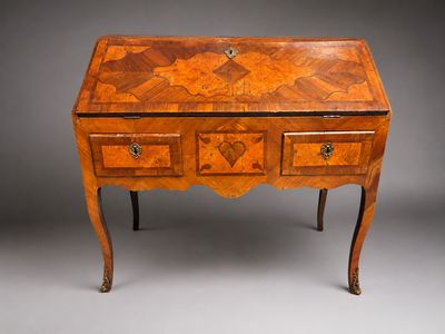 an old wooden desk with drawers and drawers on top of it