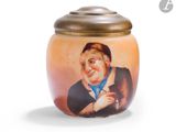 a small jar with a picture of a man on it