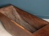 a wooden box that is sitting on the floor