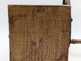an old wooden box with a wooden handle on a white background