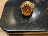 a ring that is sitting on top of a cell phone
