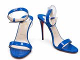 a pair of blue high heels with a bow on the toe