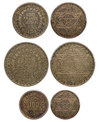 a group of five coins with a star of david on them