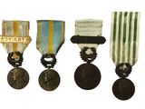 three medals and a medal on a white background with a white background