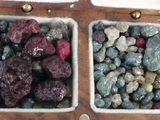two bowls with rocks in them on a table