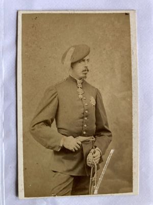an old photo of a man in a military uniform