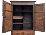 an old wooden cabinet with open doors on it