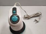 a white and blue steam iron on a white table