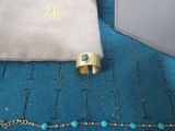 a bag and a ring sitting on a blue blanket