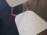 three chairs that are sitting in the corner of a room