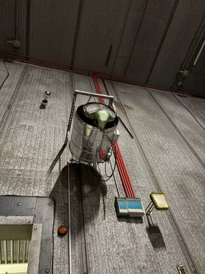 a picture of a metal container sitting on top of a train track