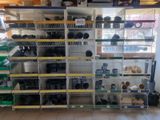many shelves with pots and pans on them in a store