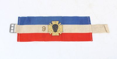 une ceinture sur laquelle est représenté un blason