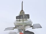 a small model of a space ship on a white surface