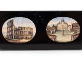 two plates with a picture of a city on them