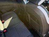 two seats in the back of a car with a seat belt