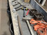 a long table with tools on it in a warehouse