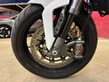 a close up of a motorcycle parked in a parking lot