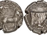 a silver coin with an image of a man on it