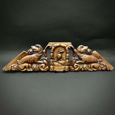 an image of a wooden sculpture of two birds and a man