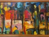 un tableau sur le mur d'une pièce avec un tableau sur le mur
