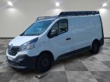 the white van is parked on a checkered floor in a room