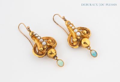 an image of a pair of gold earrings with oplite and pearls