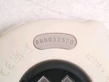 a close up of a video game controller on the floor