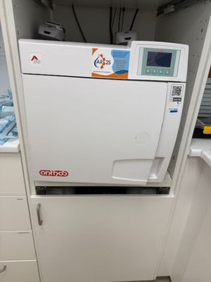 a machine that is sitting in the corner of a kitchen