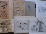 many drawings on a table with a lot of them