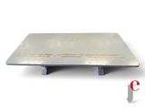 a close up of a metal plate with a white background