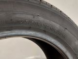 a close up of a tire on a white surface