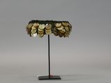 an image of a lamp with coins on it on a stand