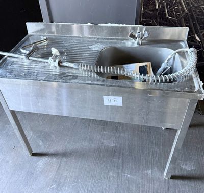a sink that is sitting on a table in a room