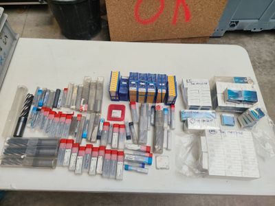 a lot of pens and other items on a table