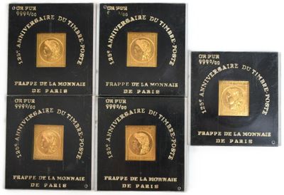 four gold coins with a picture of a man on them
