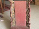 a red chair sitting on the floor in a room
